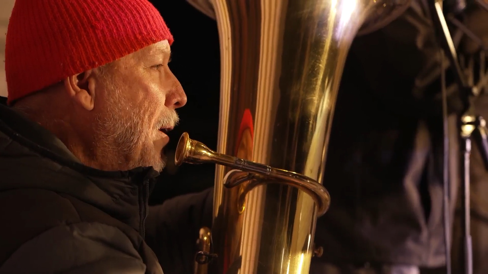 A saxophone player performing at the courthouse lighting celebration