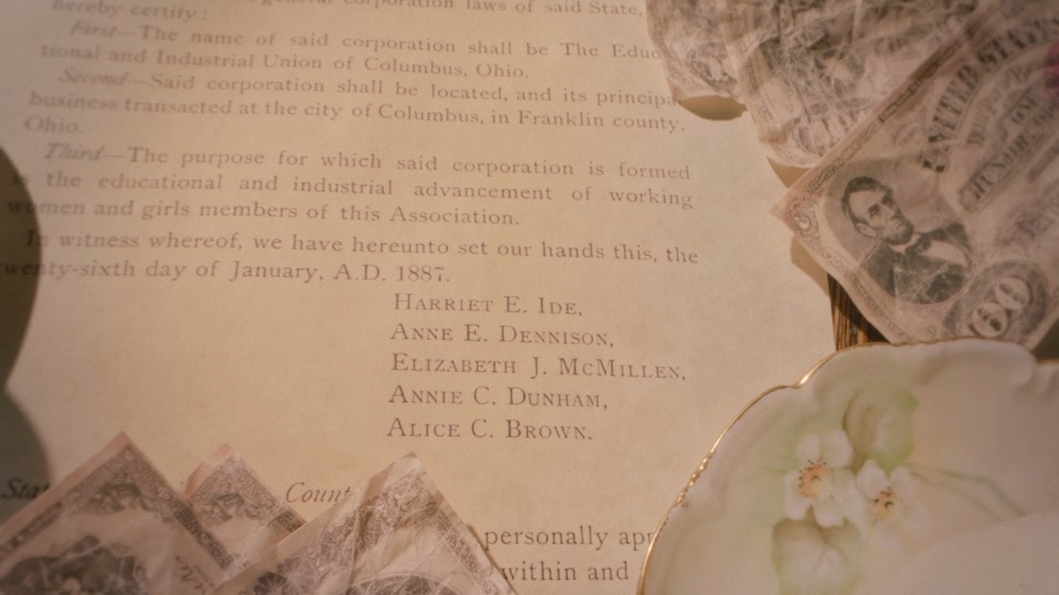 Close view of archival material in the YWCA anniversary film